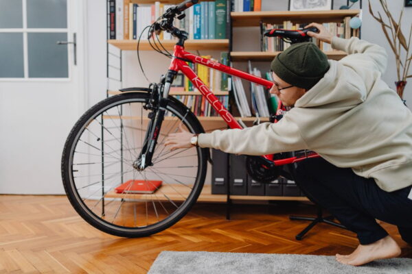 Person adjusting the saddle height on a bicycle